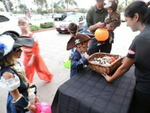 Kids trick or treating with the towne center merchants