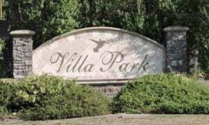The Villa Park sign at Katella with hummingbird